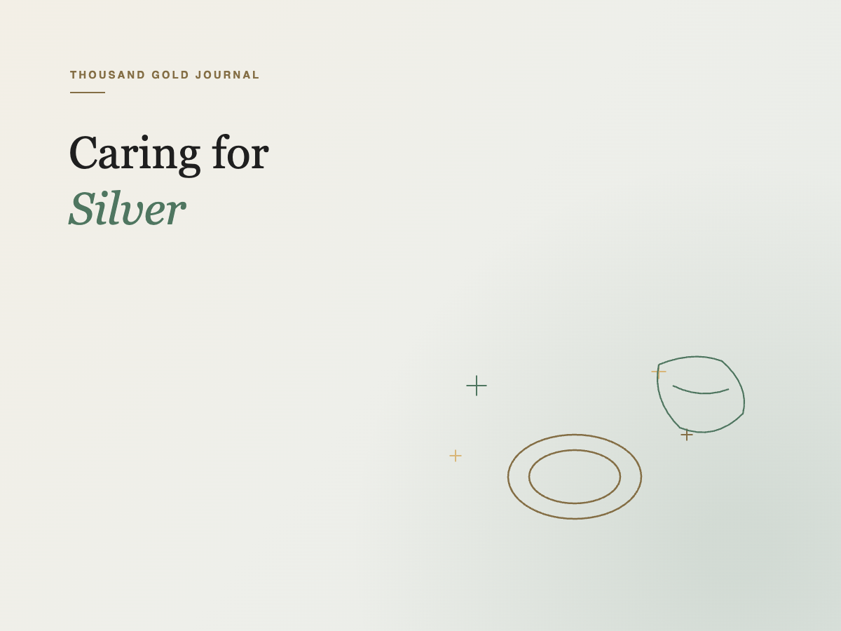 Line-art illustration of a ring, sparkles, and a polishing cloth, for the article on caring for sterling silver jewellery