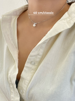 Pearl necklace on a person with sterling silver 