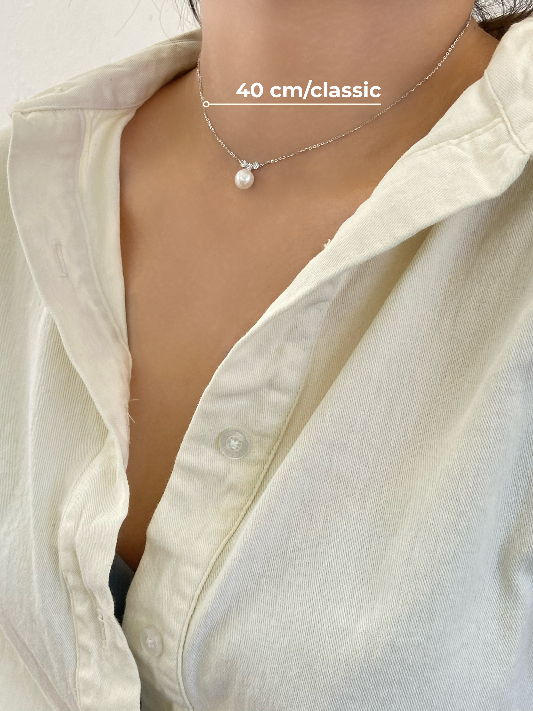 Pearl necklace on a person with sterling silver 