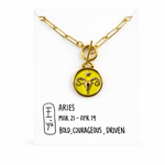 Aries necklace gold plated necklace with a yellow pendant featuring the Aries symbol on a card with the date range