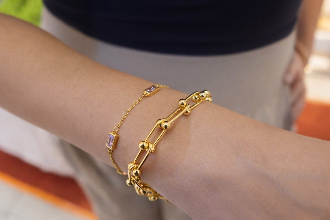 Gold plated bracelets on a person wrist 