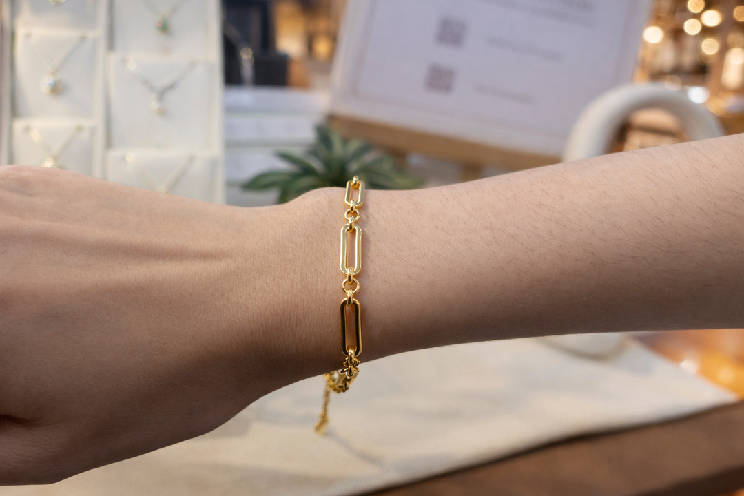 Gold plated stainless steel bracelet on a wrist 