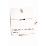 Bracelet with tourmaline beads on a card with text