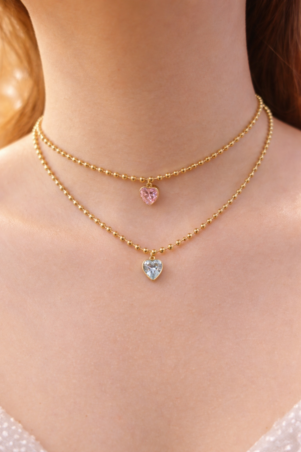 Beloved gold plated necklace with heart shaped gemstones 