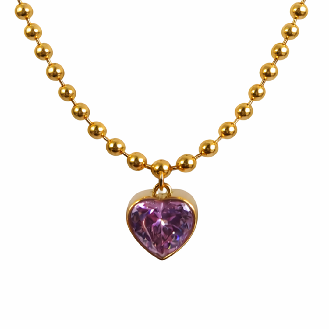 Beloved gold necklace with a heart shaped purple gemstone pendant 