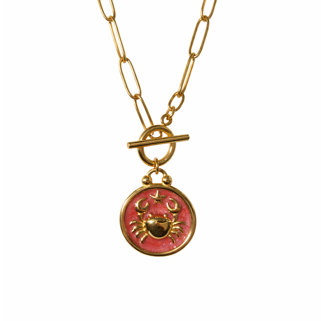 Gold plated necklace with a pink pendant 