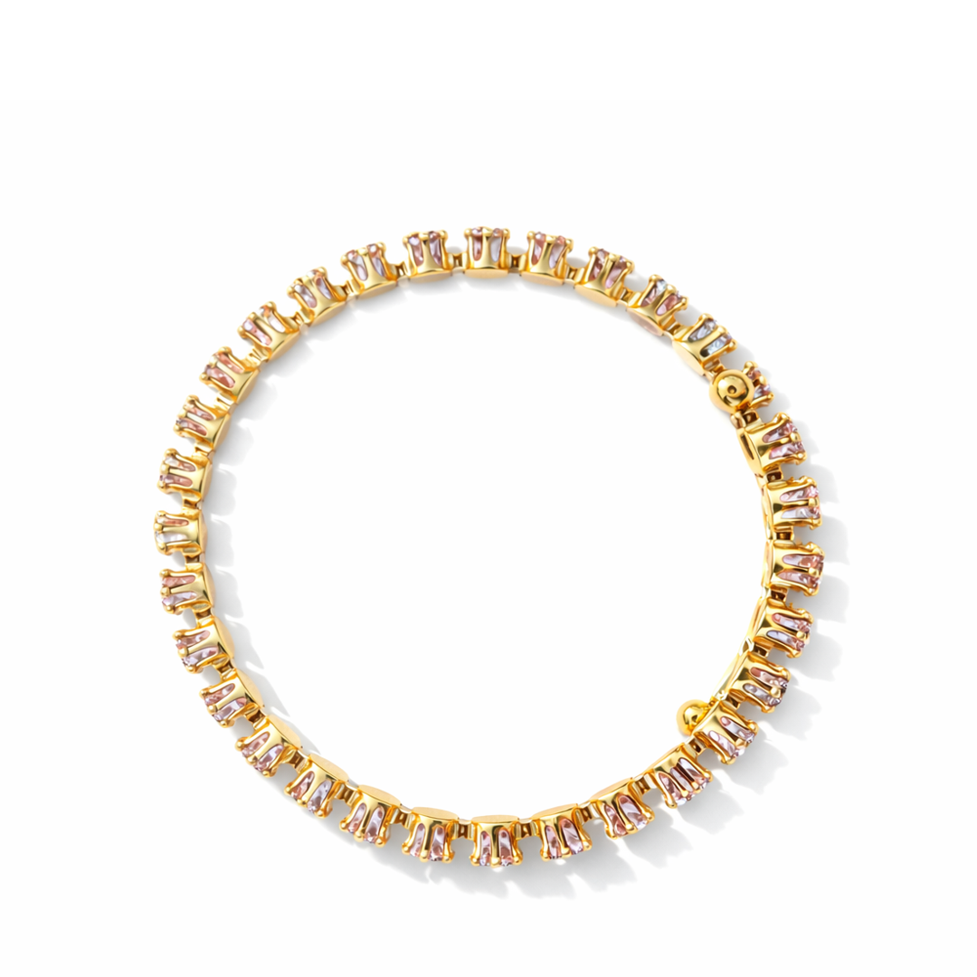 Celestial cuff  gold plated bracelet with gemstones on a white and light purple bracelet top down view