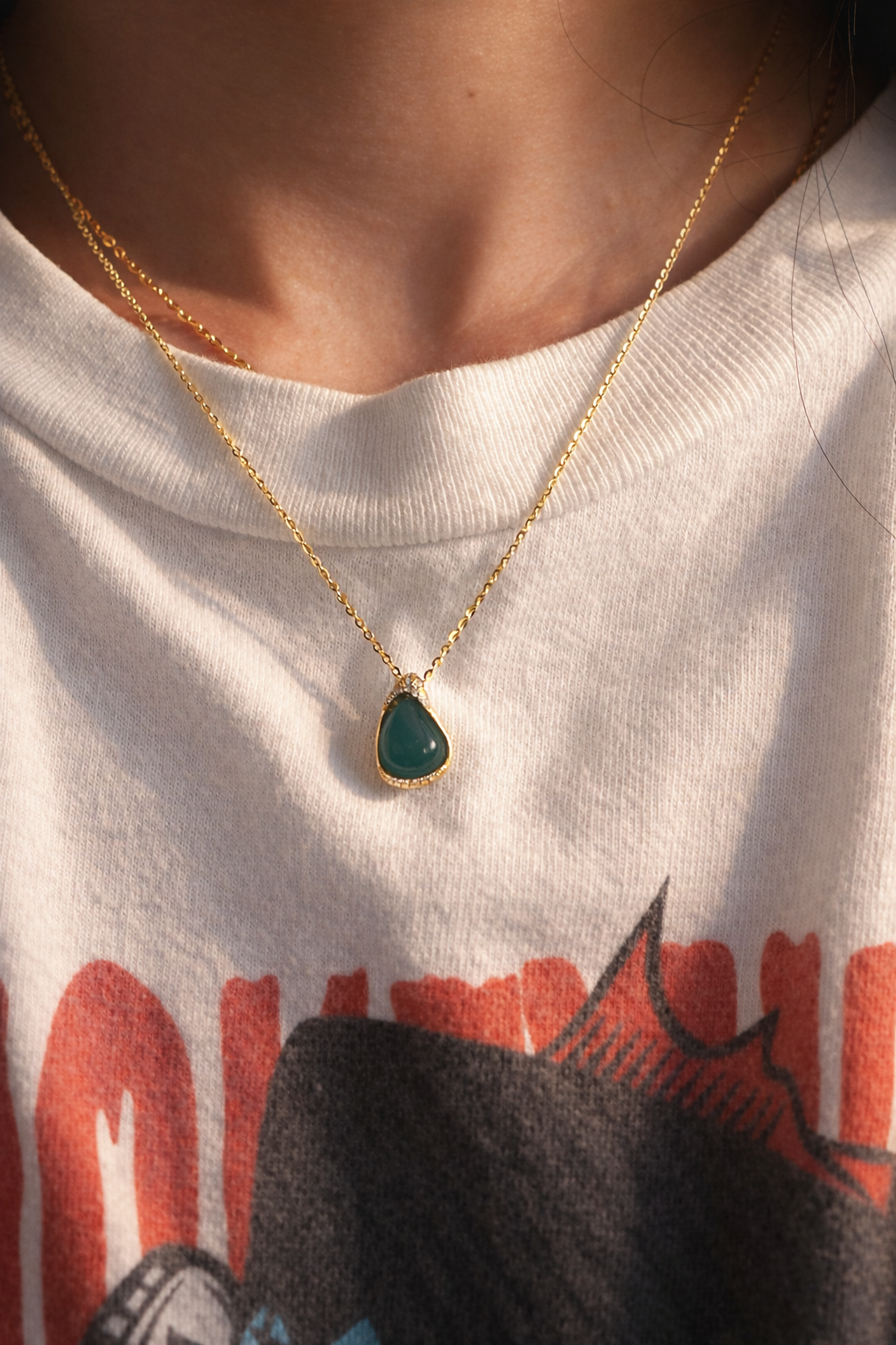 Woman wearing  Elegance jade necklace with green teardrop pendant