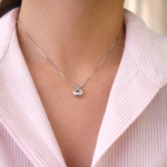 sterling silver necklace with a pendant worn by a person 