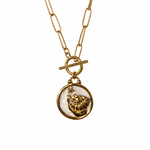 Leo necklace  Gold necklace with a round pendant featuring a lion design