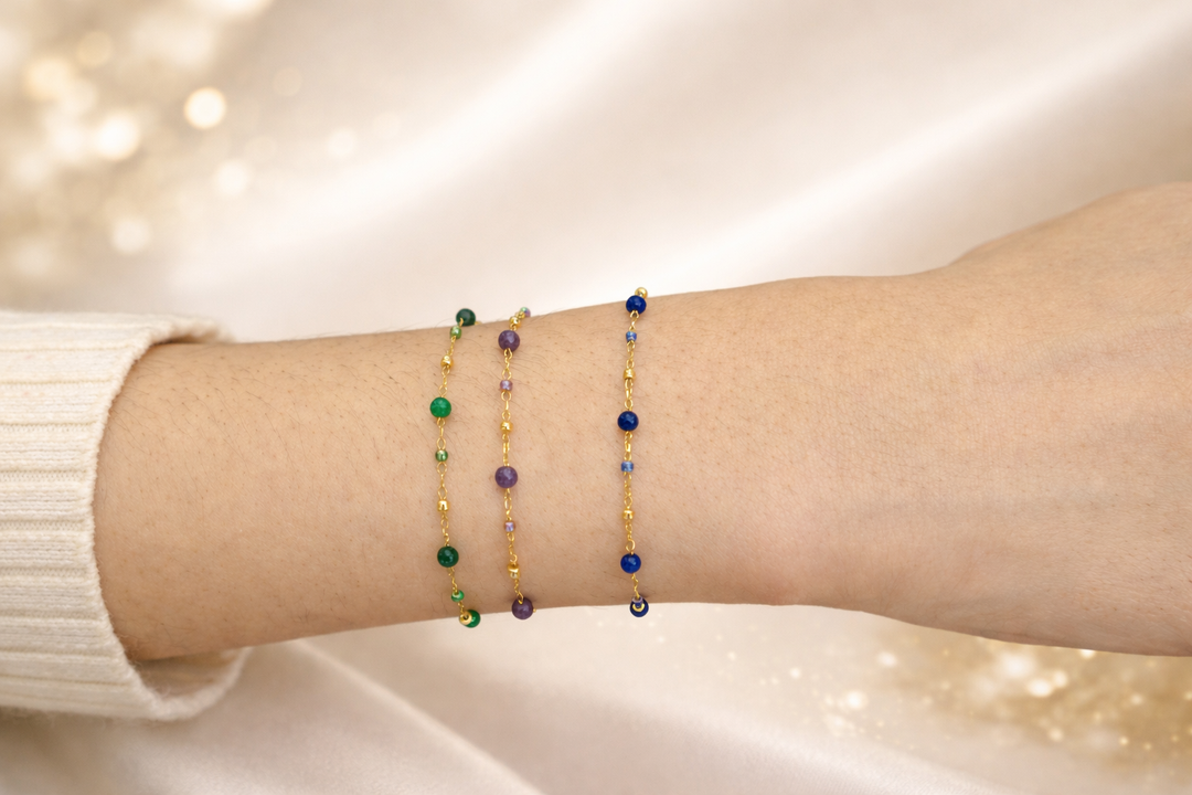 Woman wearing Little Wishes green, purple and bead bracelet