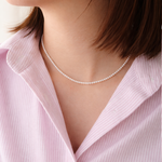 3mm pearl necklace worn by a person 