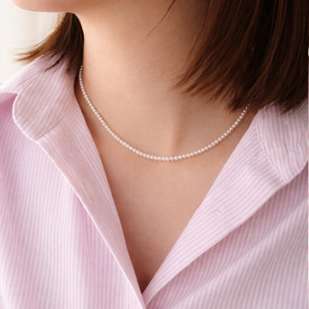 3mm pearl necklace worn by a person 