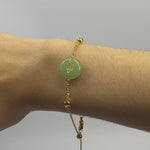 Woman wearing Ling’s Halo green jade bracelet in sterling silver video