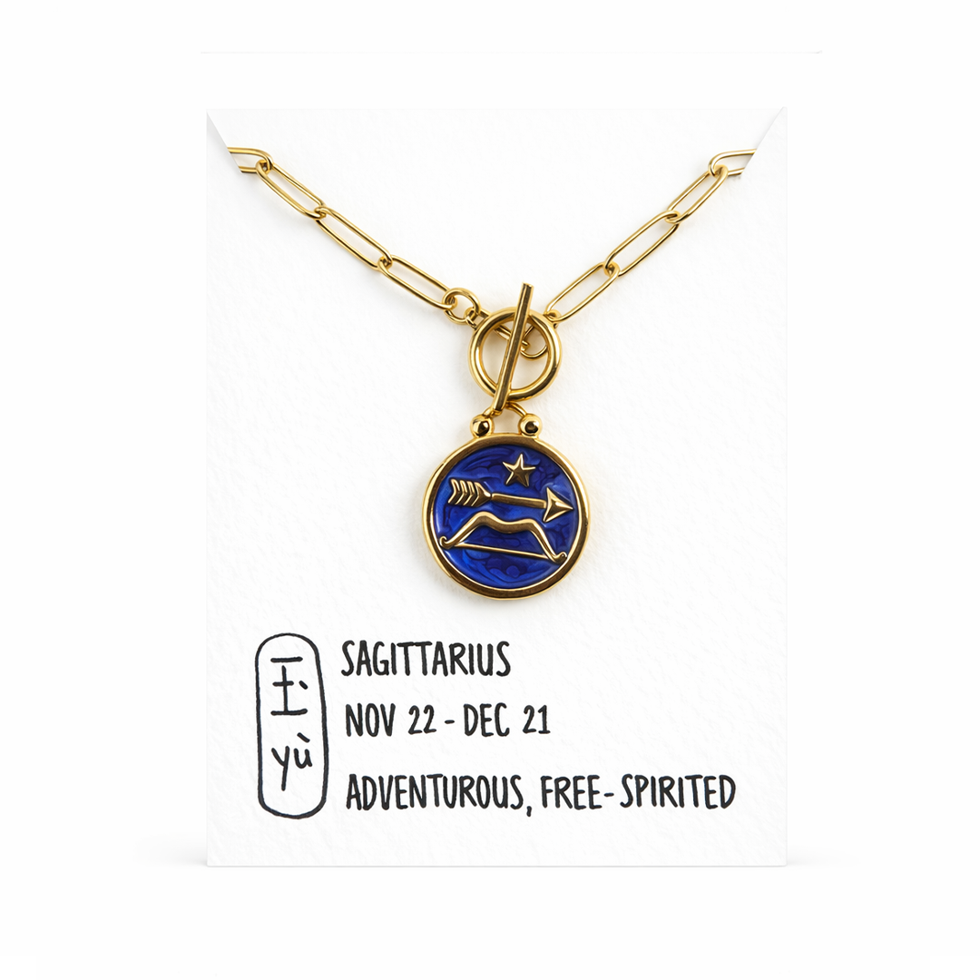 Sagittarius necklace gold plated stainless necklace with a blue pendant featuring a star and arrow design in resin on a card with the date range 