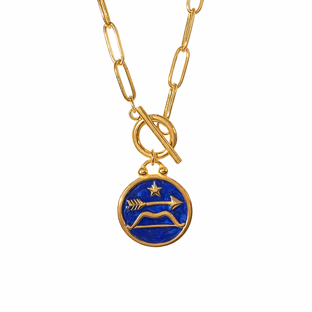 Sagittarius gold plated stainless necklace with a blue pendant featuring a star and arrow design in resin