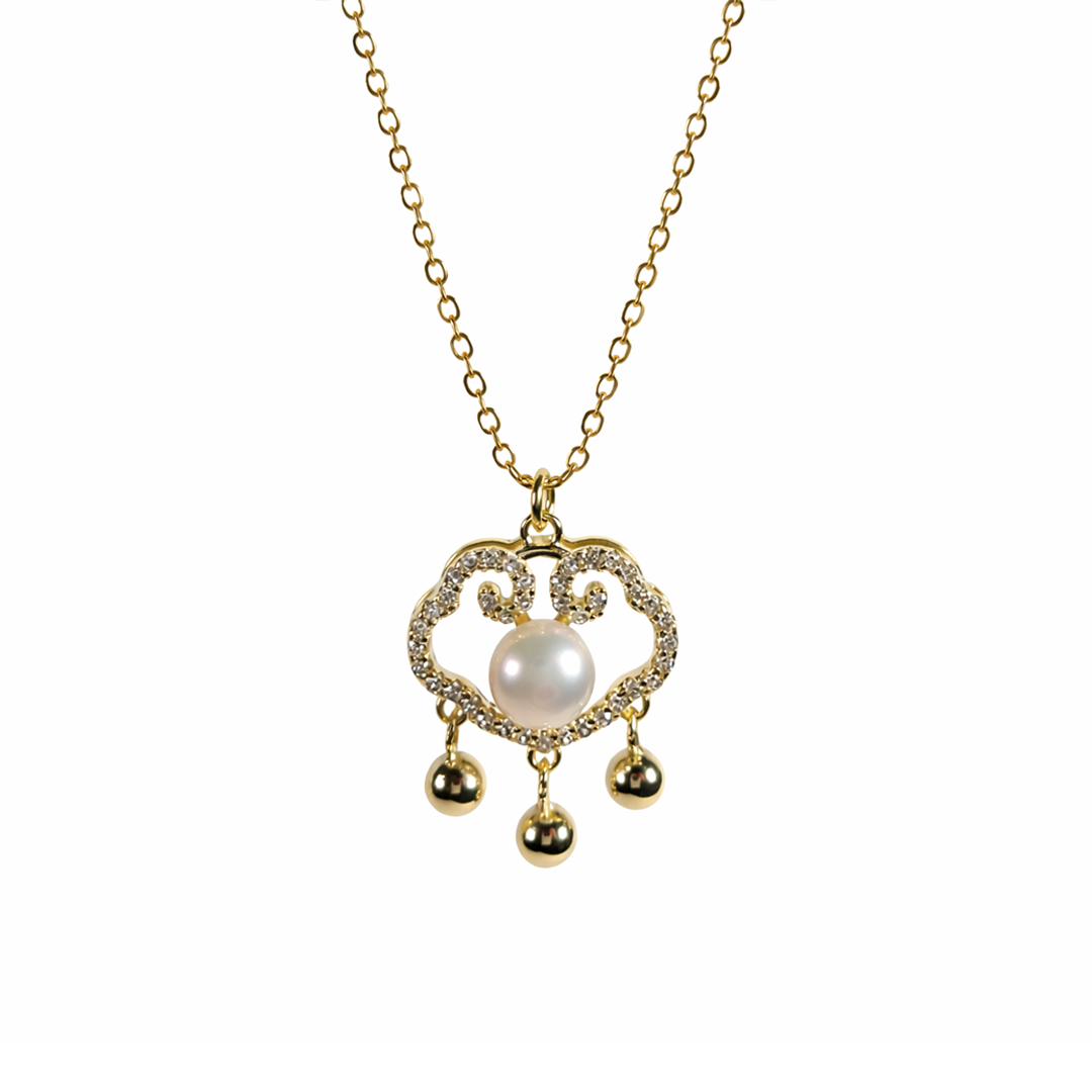 Gold plated necklace with pendant featuring a pearl and small gold plated sterling silver balls 