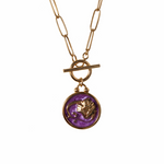 Virgo necklace with a purple pendant featuring a unique design on resin