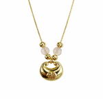 Gold plated necklace with a circular pendant and white beads